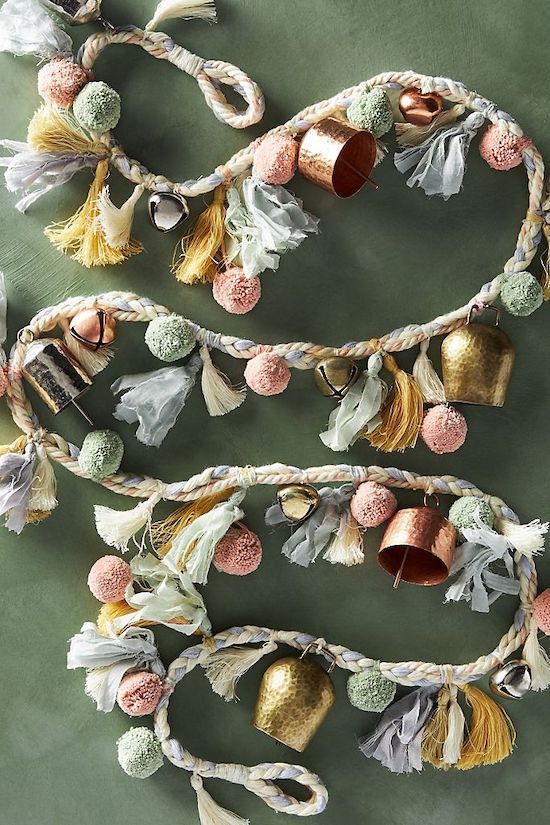a gorgeous garland of pastel pompoms, vintage and usual bells and tassels for a Christmas tree or some space
