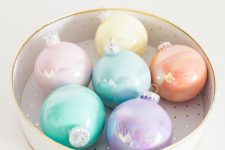 a round box with lovely pastel Christmas ornaments with a glossy touch is a lovely and pretty decor idea for the holidays