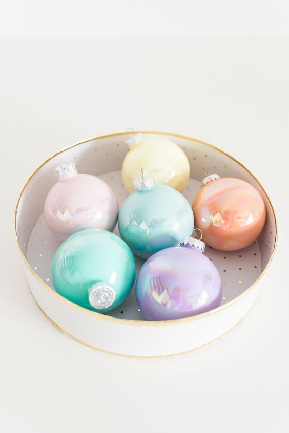 a round box with lovely pastel Christmas ornaments with a glossy touch is a lovely and pretty decor idea for the holidays