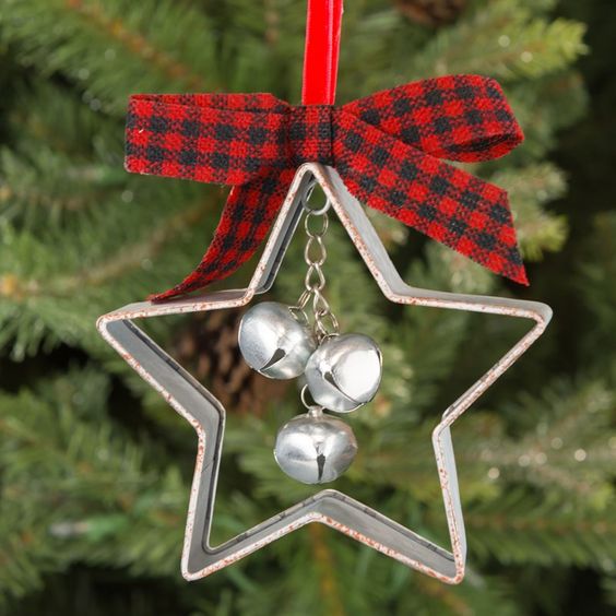 a vintage Christmas ornament of a star cookie cutter, bells and a plaid bow is amazing for tree decor