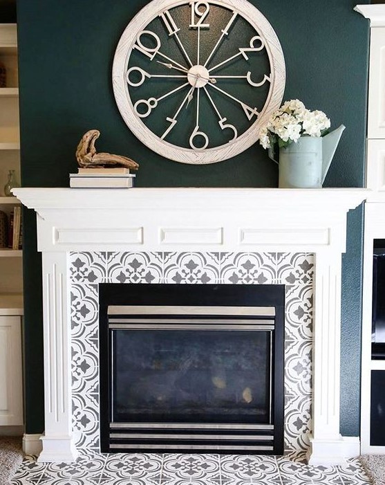 grey and white pattern mosaic tiles around the fireplace and on the floor plus a vintage white mantel create a chic and refined look