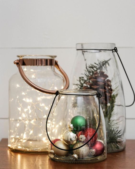 jars with evergreens and pinecones, colorful ornaments and some lights look super chic and very up to date