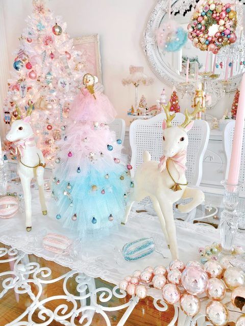 lovely pastel Christmas decor with an ombre Christmas tree with colorful ornaments, mini deer, a white Christmas tree with pastel ornaments