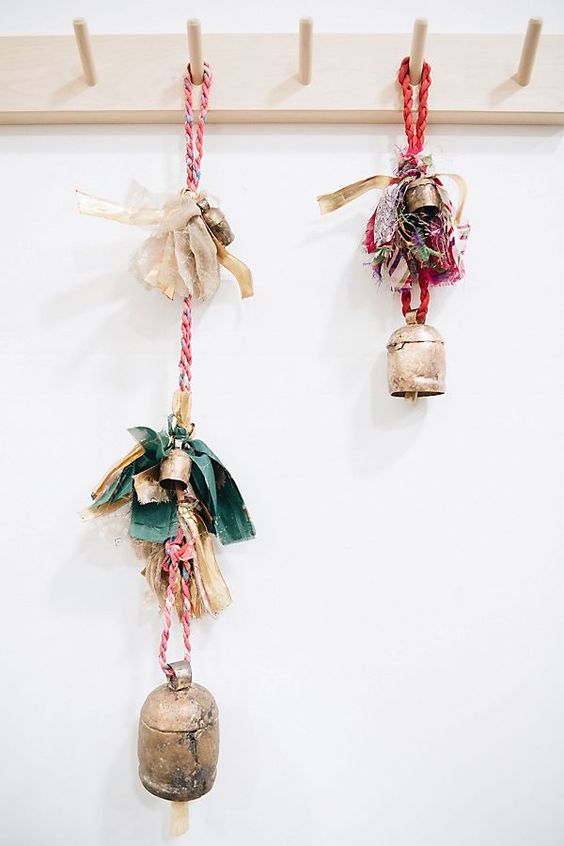 vintage Christmas bells with bright bows and pieces of fabric can accent many spaces of your home