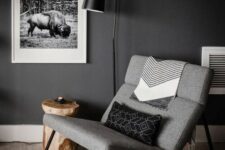 a beautiful grey mid-century modern rocker with black metal legs and no armrests will make a statement in the space