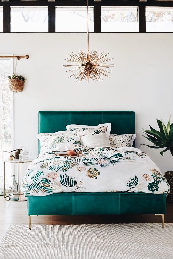 a bold teal leather mid-century modern bed with gold legs is a bright touch to your space