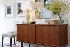 a classy rich-stained mid-century modern sideboard with two sliding doors on cone legs is a lovely idea for a modern space