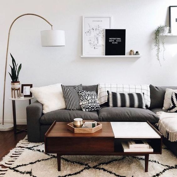 a color block mid-century modern coffee table, dark stained but with a white accent, with a closed and open storage compartment