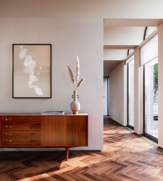 a cool mid-century modern sideboard with doors and drawers, on small and sturdy legs is a lovely idea for your space