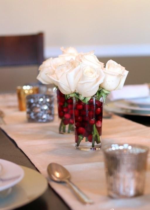 a duo of glasses with cranberries and white roses is a lovely Christmas decor idea that you can easily realize