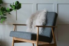 a mid-century modern chair with a stained frame and legs, grey upholstery is always a comfortable and cool idea