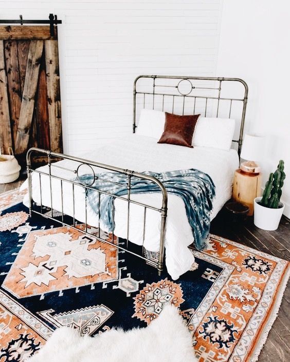 a retro metal bed like this one is a stylish solution for a modern or boho space