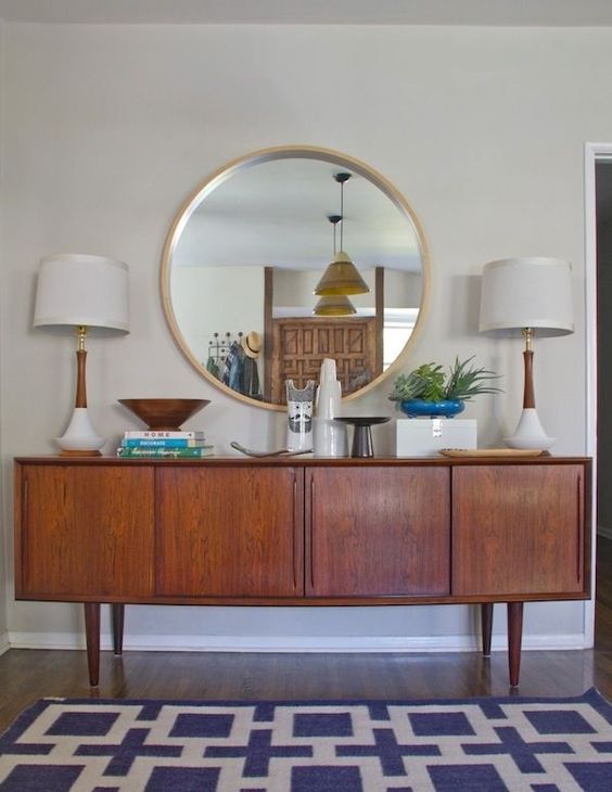 a rich-stained mid-century modern sideboard with doors with thin handles is a lovely idea for a modern space