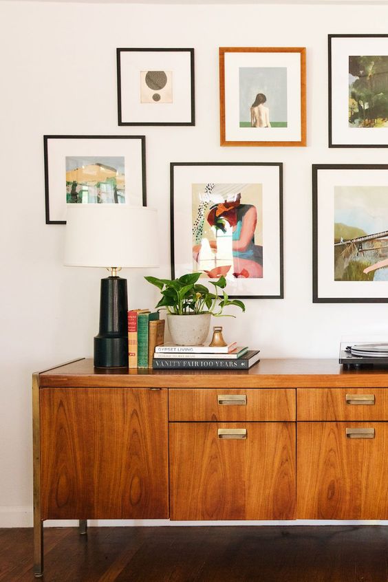 a rich-stained mid-century modern sideboard with drawers and doors and metal handles is a lovely idea to rock