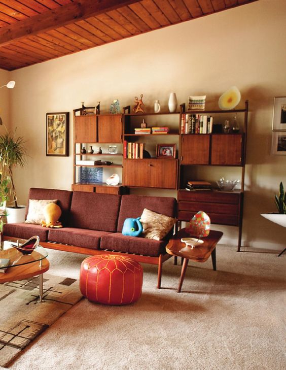 a rich stained storage unit with closed cabinets, shelves and drawers for a stylish mid-century modern interior