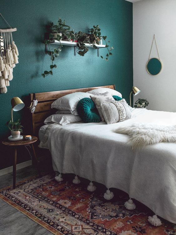 a rich-stained wooden bed with a plank headboard and matching nightstands for a mid-century modern space