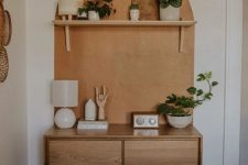 a small and chic mid-century modern sideboard with doors and on cone legs will give you a bit of storage space and can fit an awkward nook