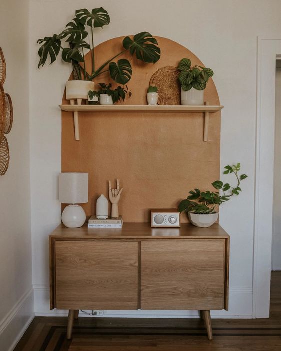 a small and chic mid-century modern sideboard with doors and on cone legs will give you a bit of storage space and can fit an awkward nook