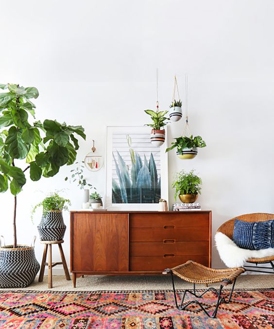 a small and cut stained sideboard with a sliding door and drawers with cutout handles is a lovely idea for a mid-century modern living room