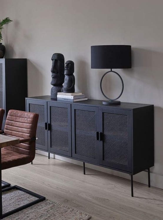 a sophisticated modern black buffet with cane doors is a fresh and modern take on thos traditional pieces that looks edgy