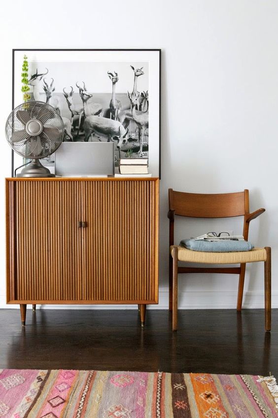 a stained fluted cabinet on cone legs will fit a mid-century modern, boho or even contemporary space