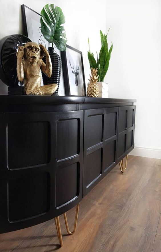 a stylish black rounded sideboard with paneling and hairpin legs is a lovely idea for a mid-century modern space