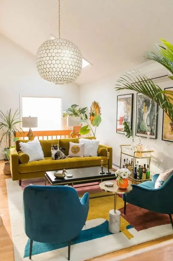 a vibrant living room in bold colors, with a mustard sofa, navy chairs, a bold abstract rug, potted plants and a cool bar cart