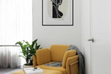 a yellow mid-century modern chair with a matching footrest and pillows plus a grey blanket is a perfect idea for a reading nook