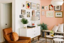 an amber leather chair with a cushion and a pillow is a cool and comfy solution for a mid-century modern space