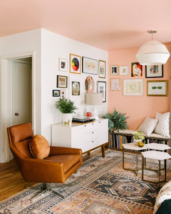 an amber leather chair with a cushion and a pillow is a cool and comfy solution for a mid-century modern space