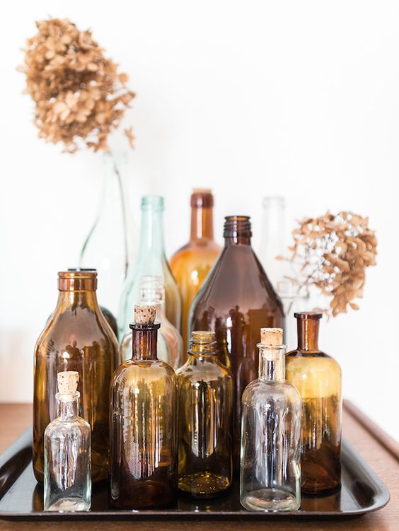 an arrangement of beautiful vintage bottles will add a bit of color and vintage feel to the space