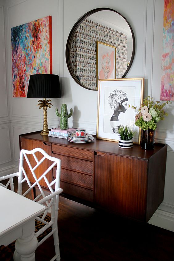 an elegant and chic dark-stained credenza with drawers and usual compartments is a perfect addition to a dining room