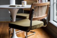 an elegant mid-century modern chair of metal, an upholstered seat and a rattan back is a cool idea for a dining room