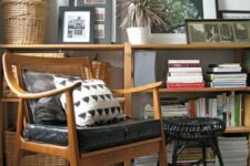 an elegant stained chair with a rattan back and a black leather seat, printed chairs is a great addition to the living room