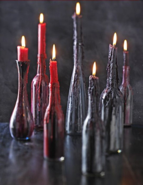 black bottles with red and deep purple wax from candles on them look scary and bloody, so you won't have to decorate the holders too much