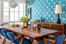 blue mid-century modern chairs with rich-stained legs, frames and armrests and cozy upholstery are great for a dining space
