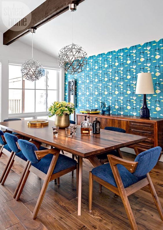 blue mid-century modern chairs with rich-stained legs, frames and armrests and cozy upholstery are great for a dining space