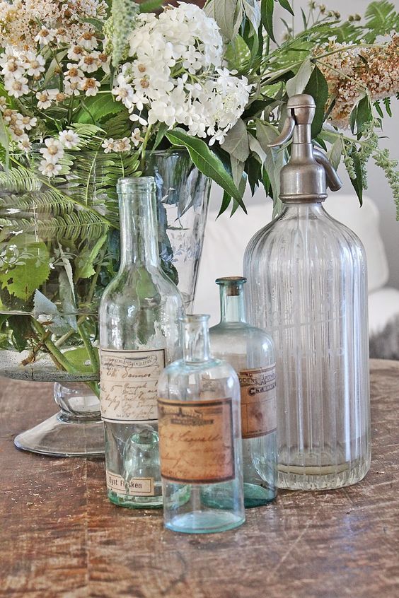 clear and light blue vintage bottles with labels will be a great shabby chic or vintage decor idea