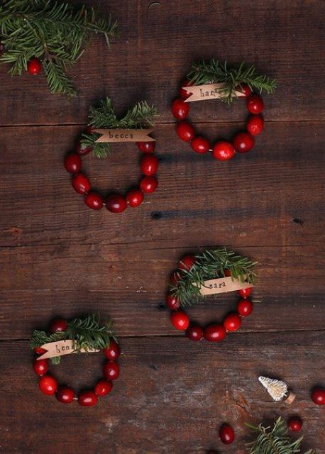 cranberry napkin rings with evergreens and names are a fast and cool decor idea for Christmas