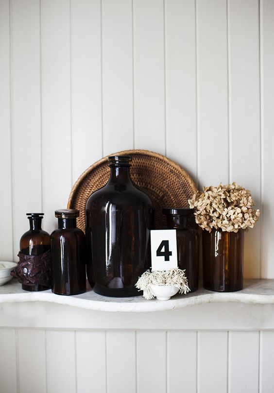 vintage apothecary bottles with dried blooms will be a nice fit for a rustic or farmhouse space