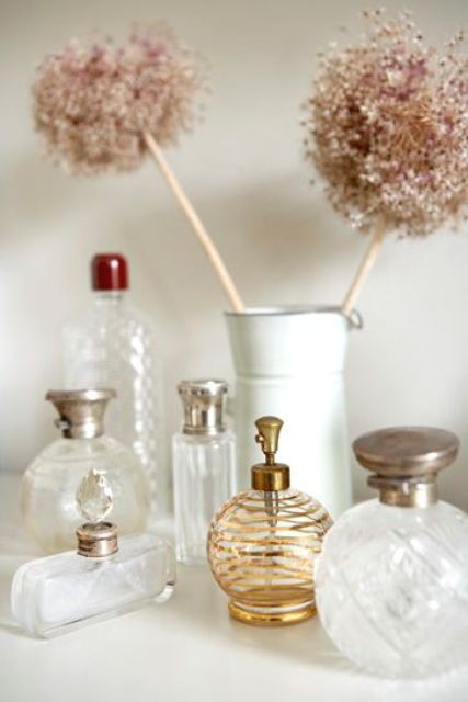 vintage perfume bottles with beautiful lids are amazing to style your space, they will make it more chic and cool