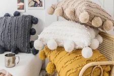 Moroccan pillows with large pompoms are ideal to add a boho touch to the space and make it eye-catchy
