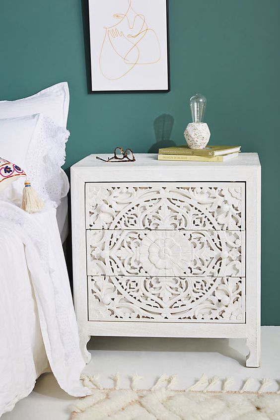 a beautiful white inlay nightstand showing off floral patterns and some other is a very refined and chic idea for a modern bedroom