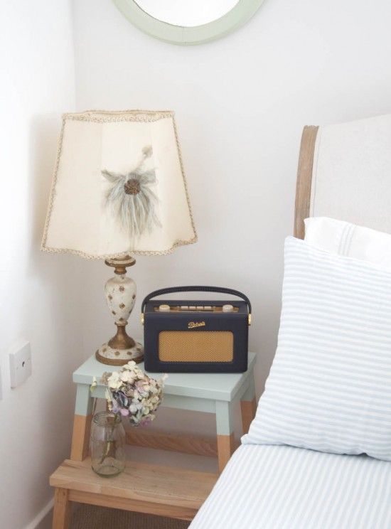 a color block staircase with a stained and an aqua part is a lovely idea of a modern nightstand, with a strong natural feel