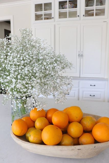 a dough bowl can serve as a storage piece for fruitsin the kitchen