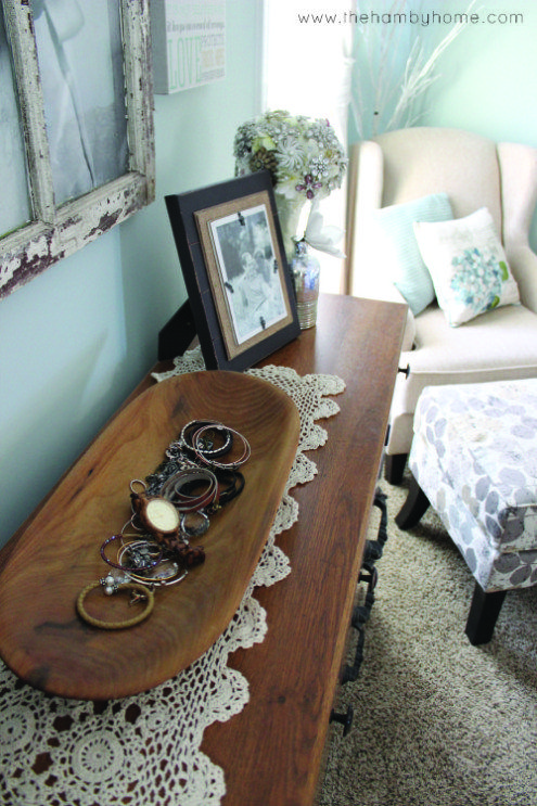a dough bowl used to store jewelry is a simple and cool idea - it's a perfect trinket dish