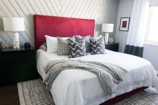 a trendy neutral bedroom with a chevron wall