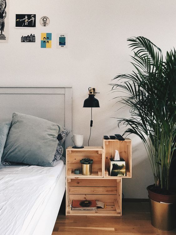 a nightstand of crates is great for storage and will give a rustic feel to the bedroom, and you may DIY it yourself easily