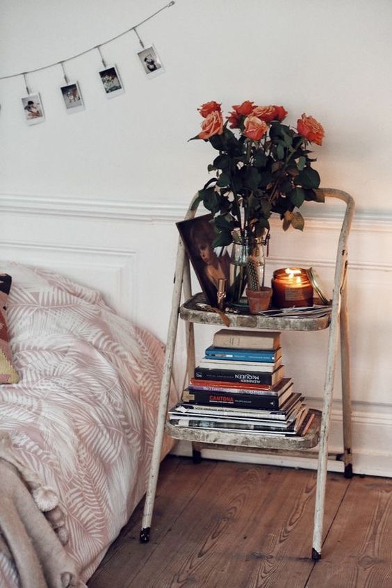 a shabby chic staircase with books, candles and blooms is a pretty and delicate touch to the bedroom design that you can get for a couple of bucks
