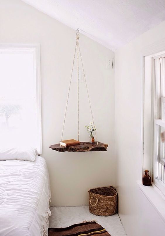 a swing nightstand of a living edge wooden piece and twine is a great way to add a lovely touch to your bedroom